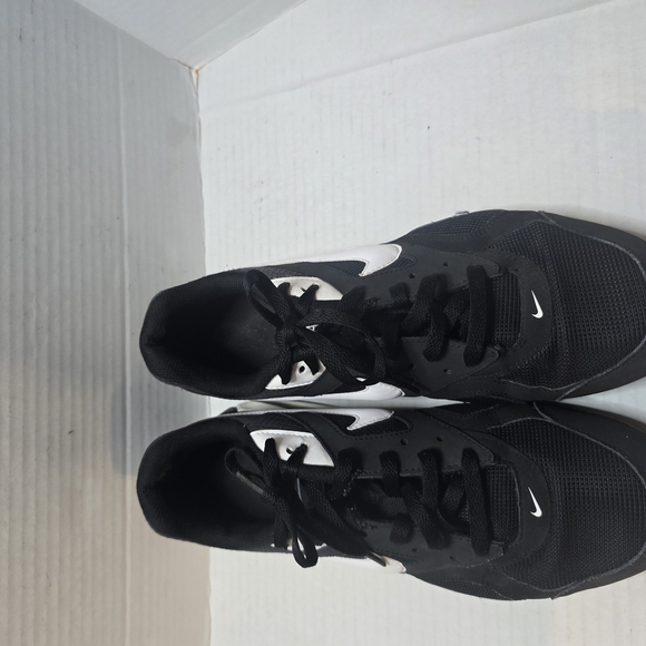 Nike Black and White Athletic Shoes with‎ Sleek Design